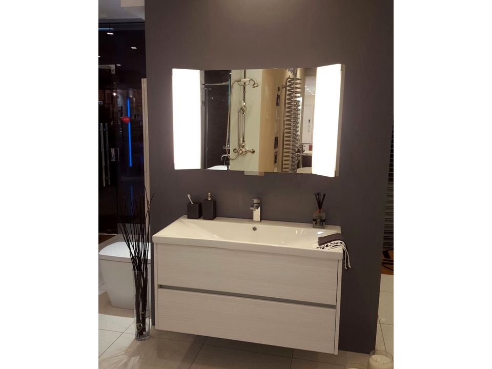 Double basin on an oak console with matching mirrors and wall lights
