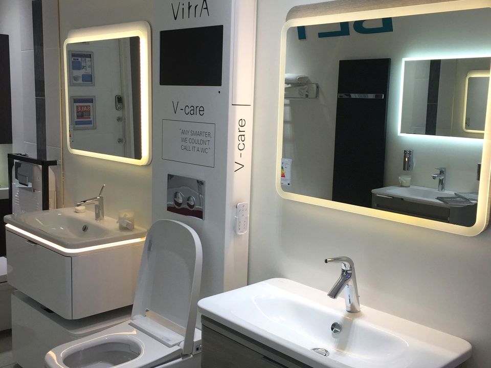 Keuco brassware display wall with illuminated shower fittings